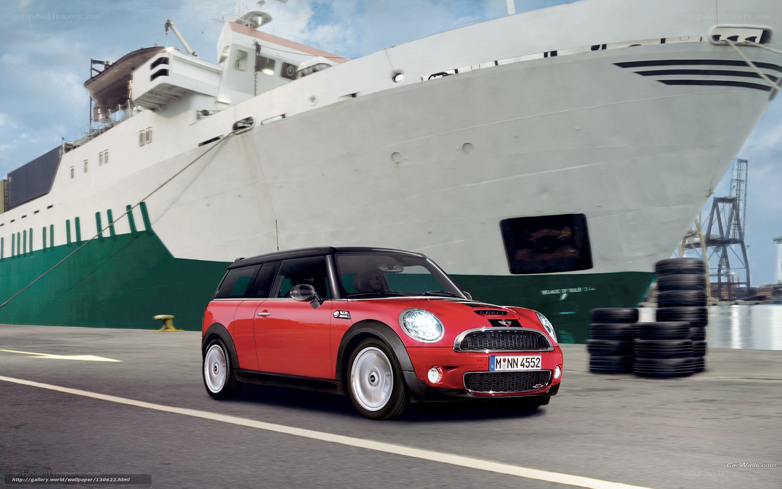 Red Mini Cooper by a ship
