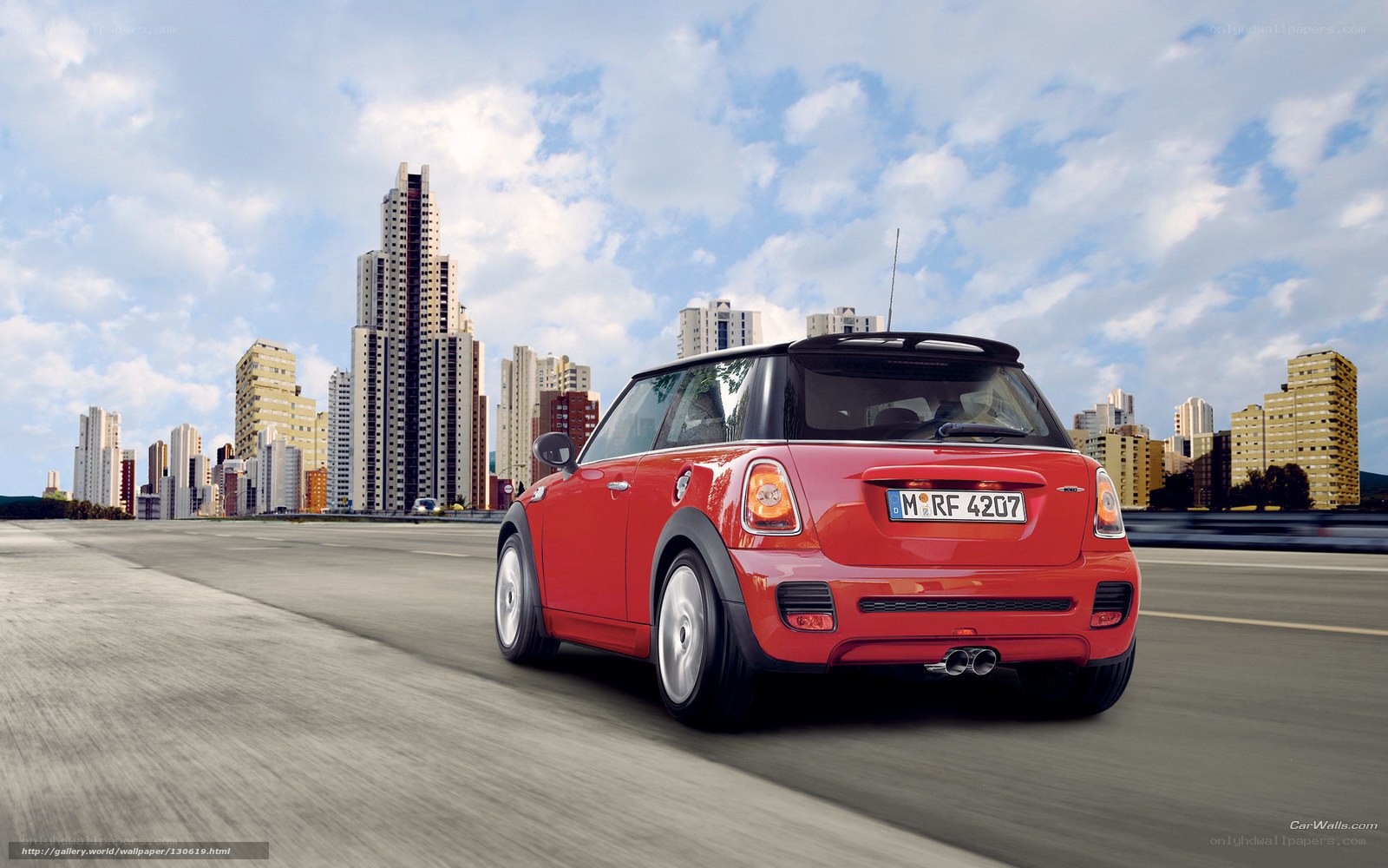 Red MINI Cooper driving in city