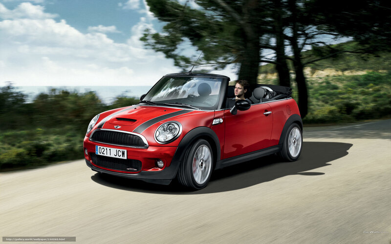 Red MINI Cooper driving on coastal road