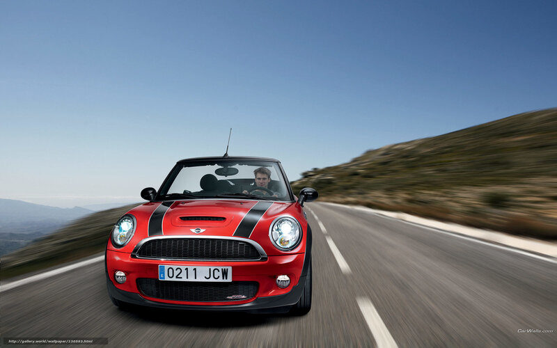 Red MINI Cooper driving on road