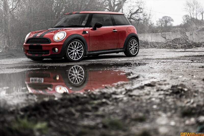 Red Mini Cooper in a puddle