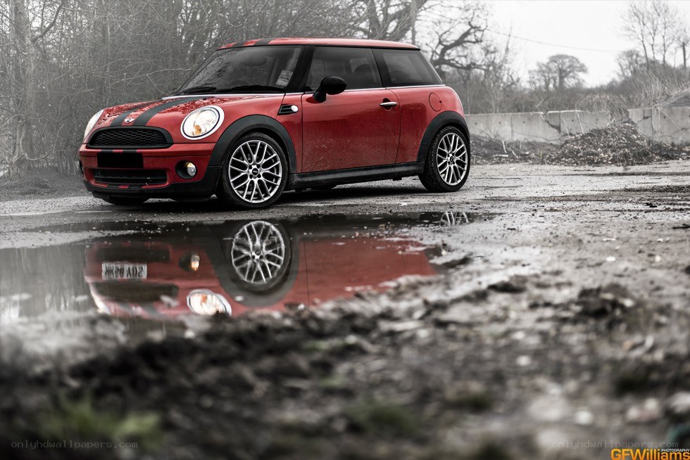 Red Mini Cooper in a puddle