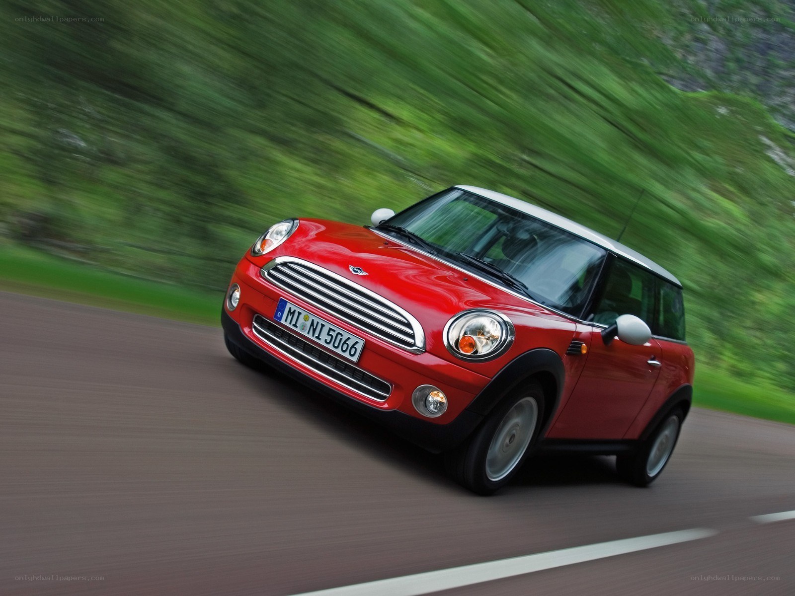 Red Mini Cooper in motion