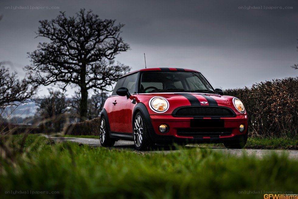Red MINI Cooper on a country road