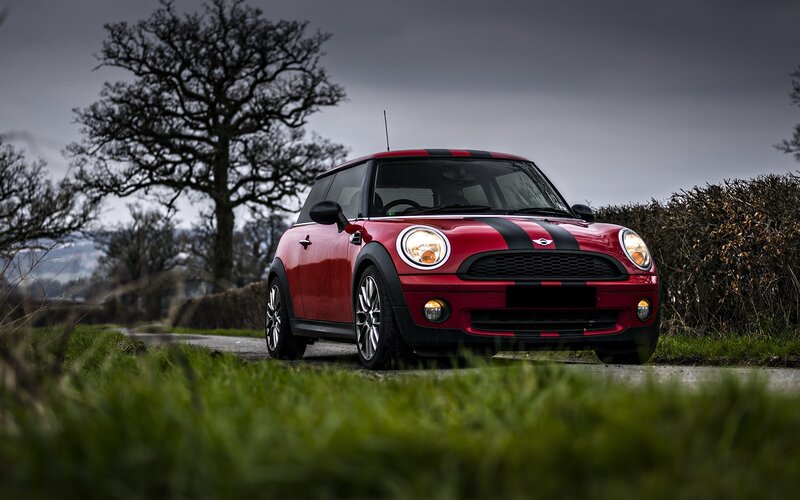 Red Mini Cooper on a country road