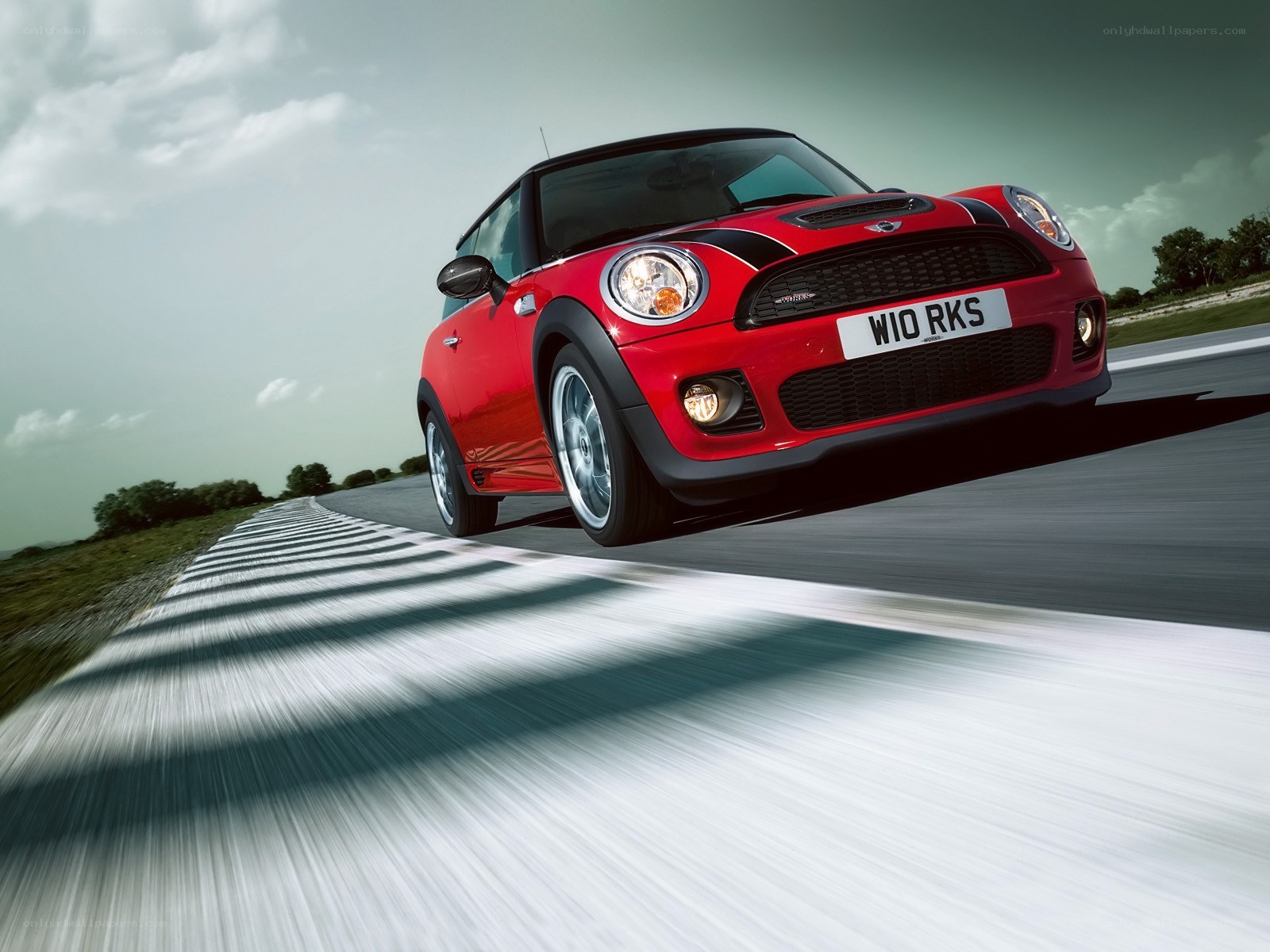 Red MINI Cooper on a racetrack