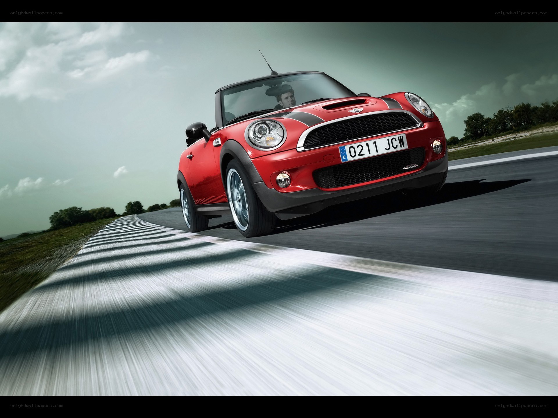Red MINI Cooper on a racetrack