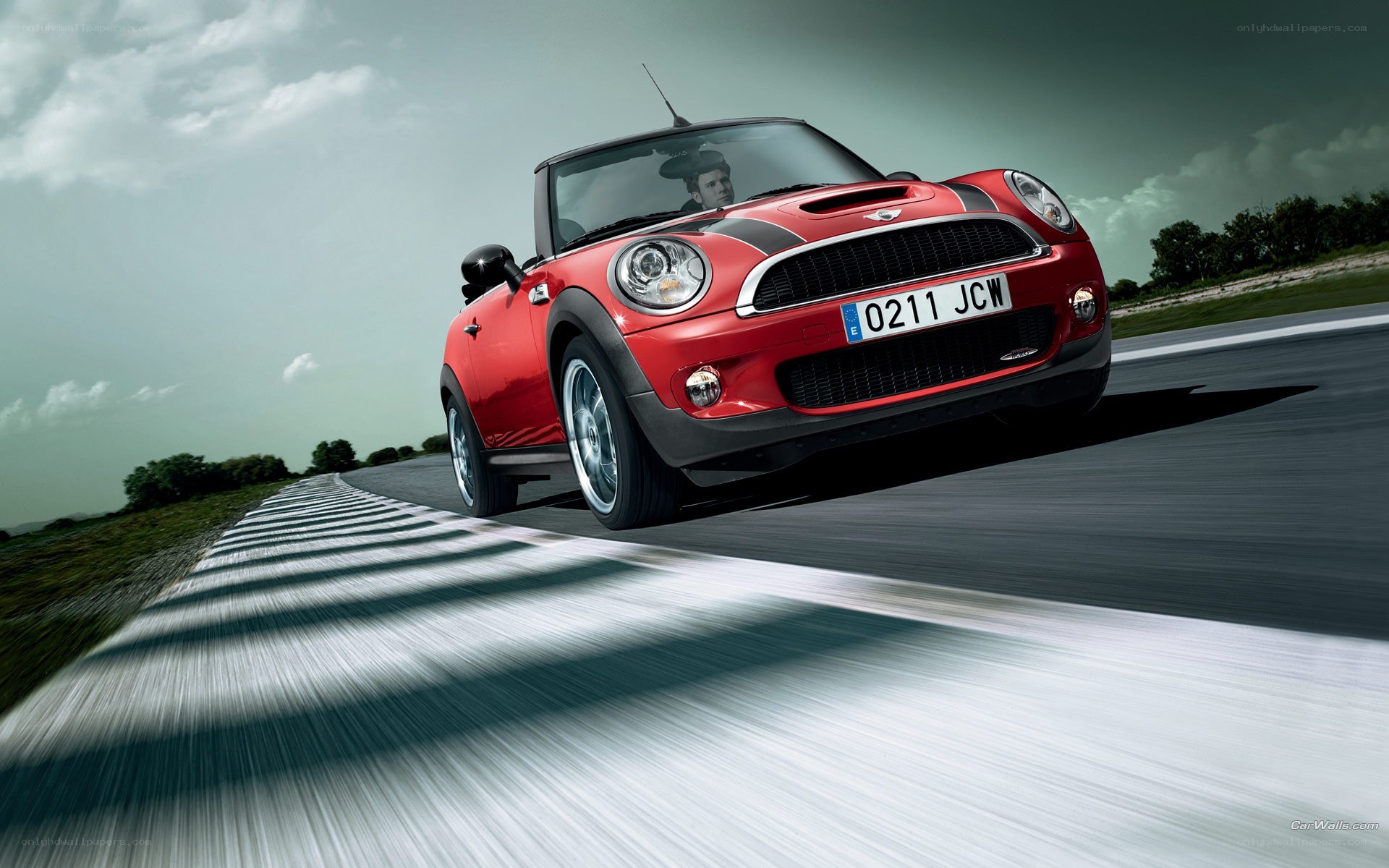 Red MINI Cooper on a racetrack