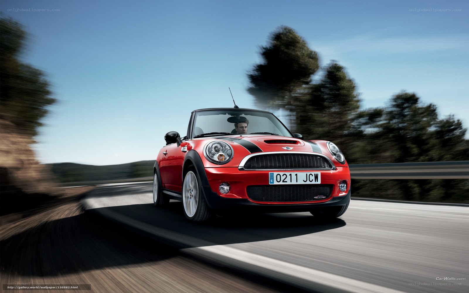 Red MINI Cooper on a scenic road
