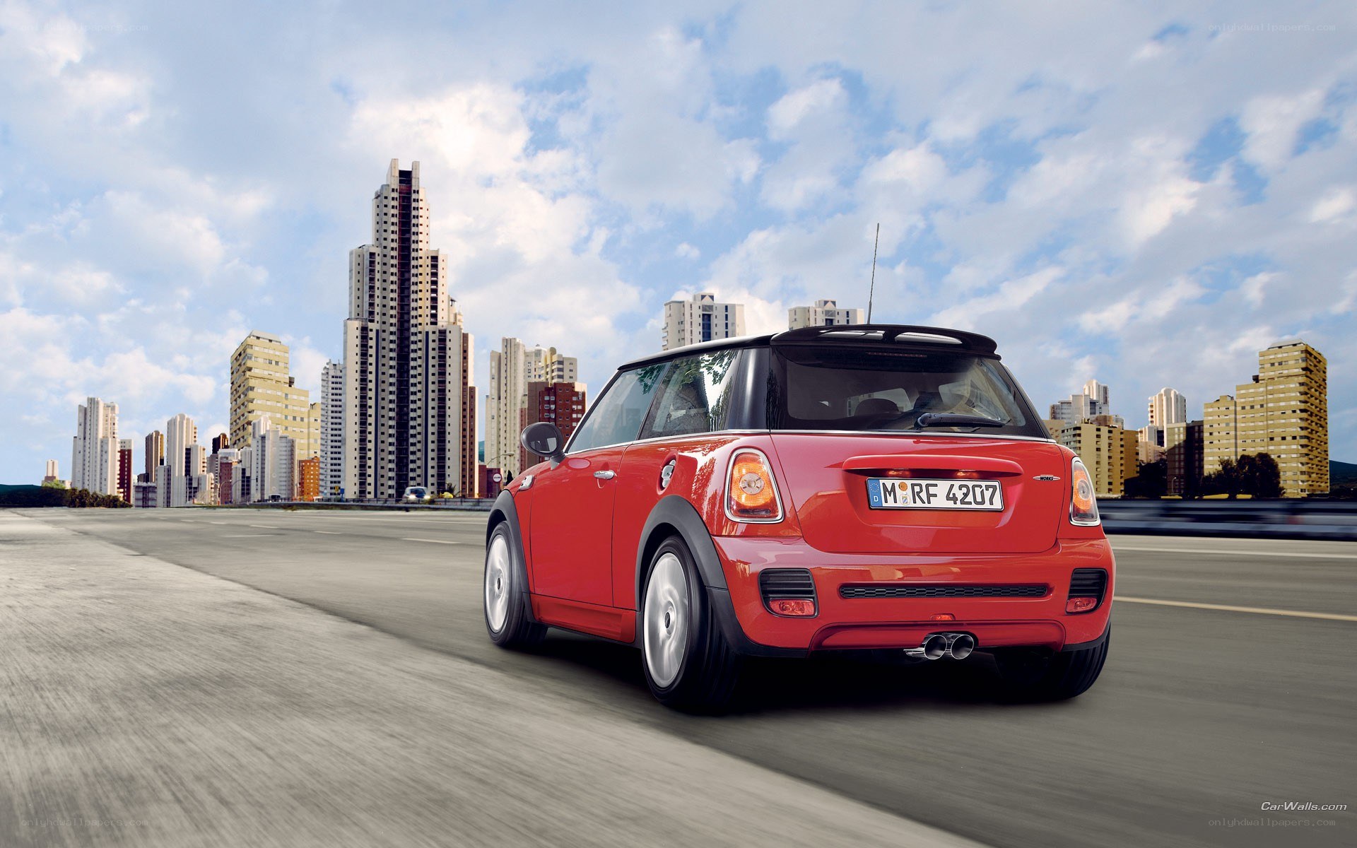 Red MINI Cooper on city road