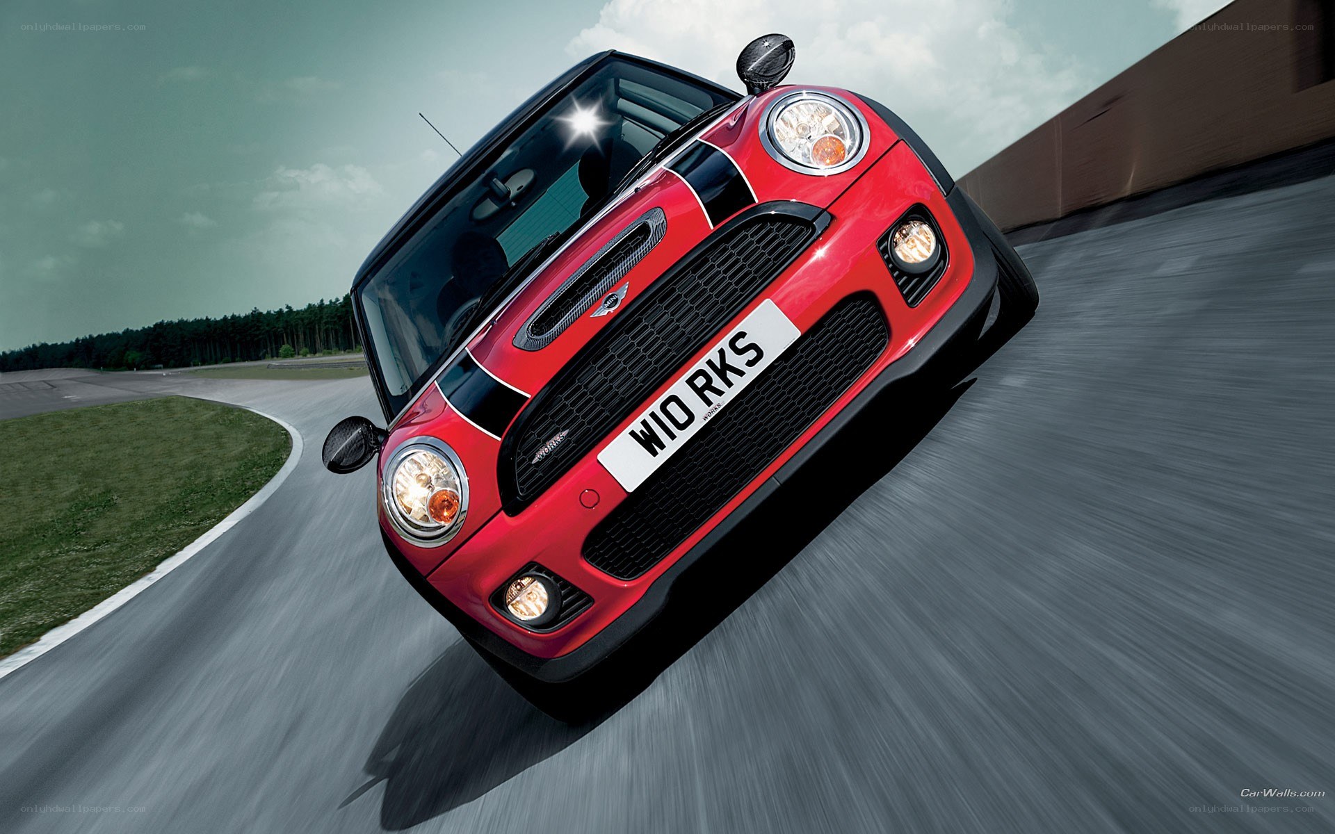 red mini cooper on racetrack
