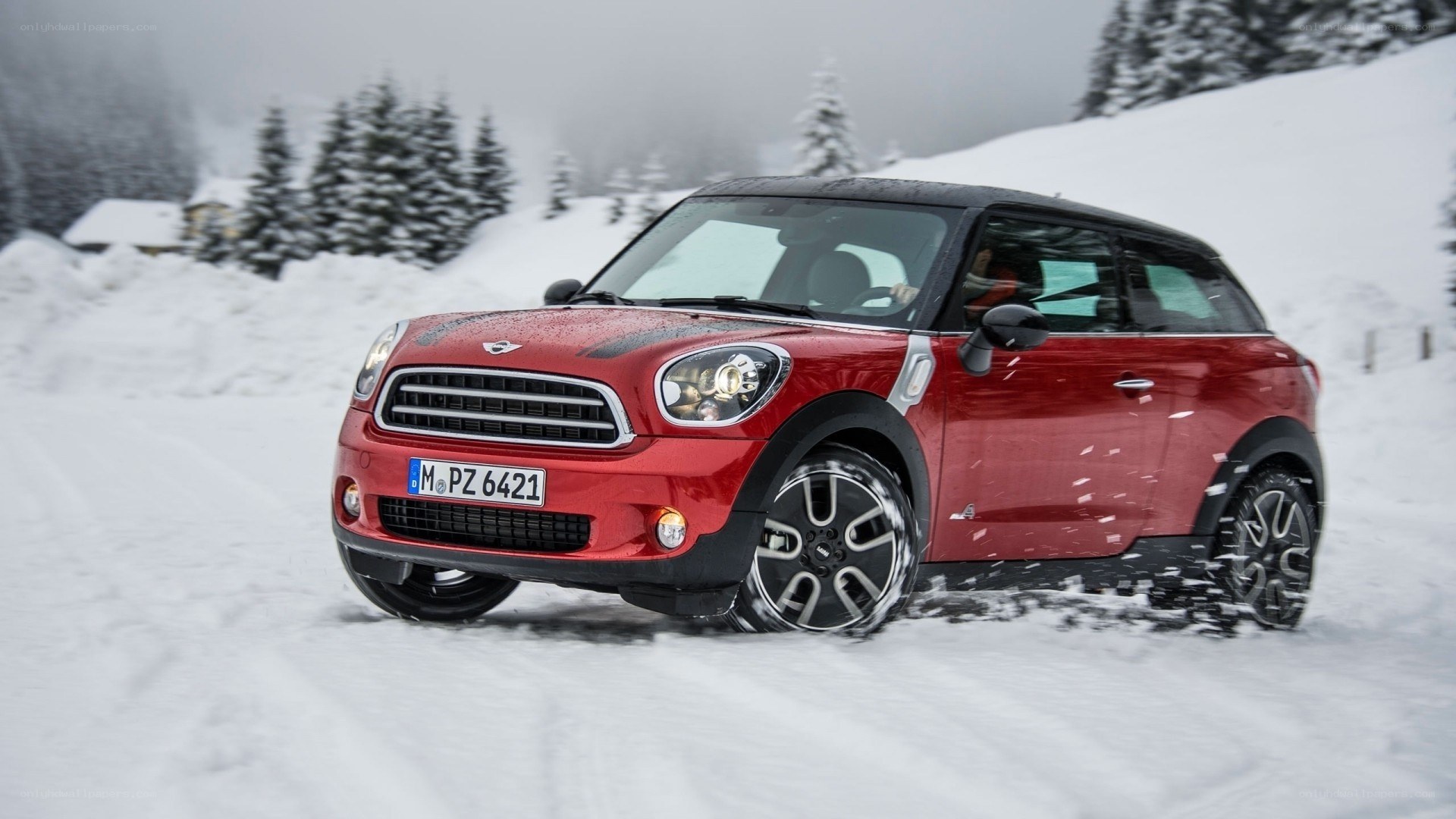 Red MINI Countryman in snow