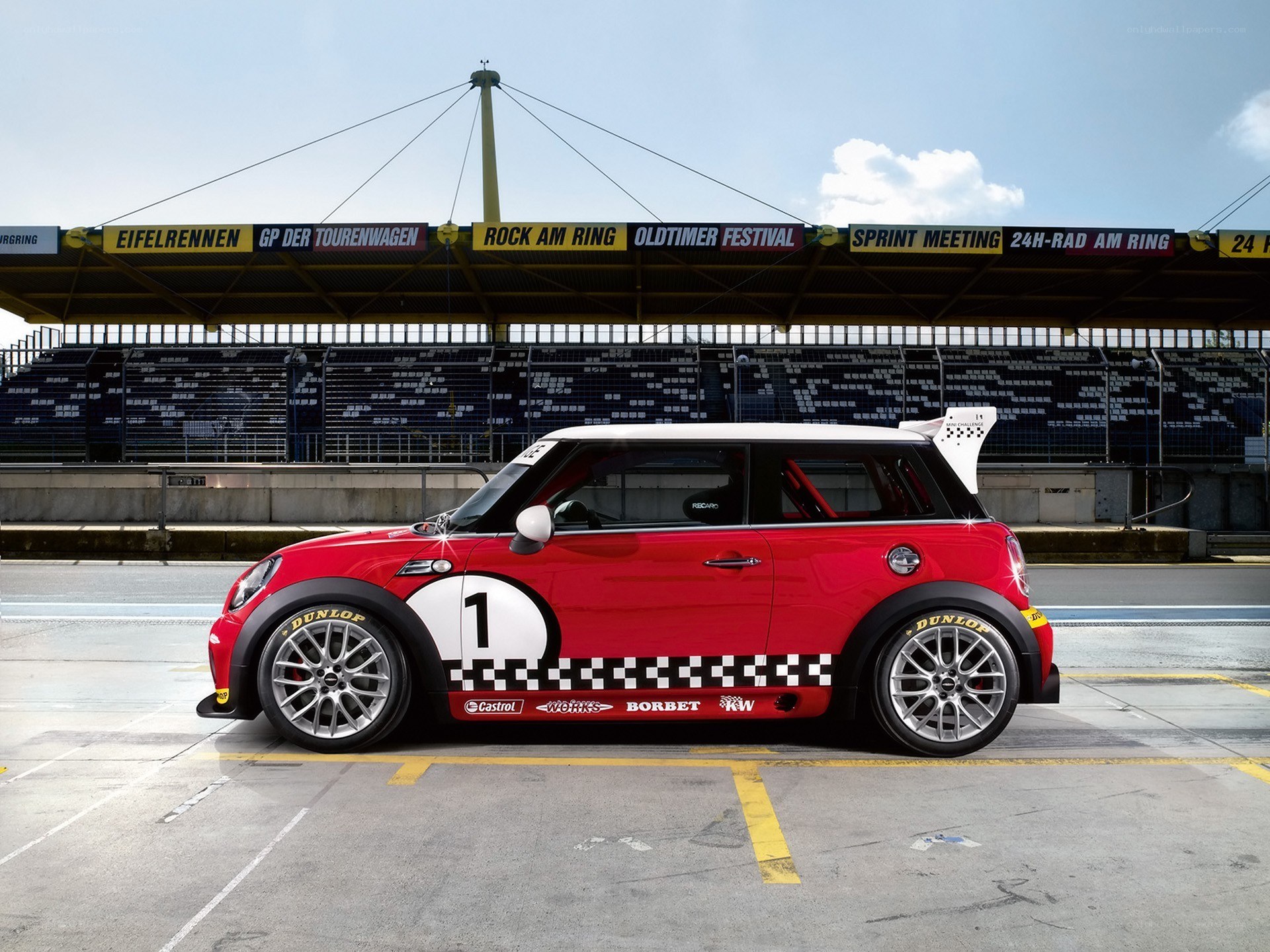 Red MINI race car at a track