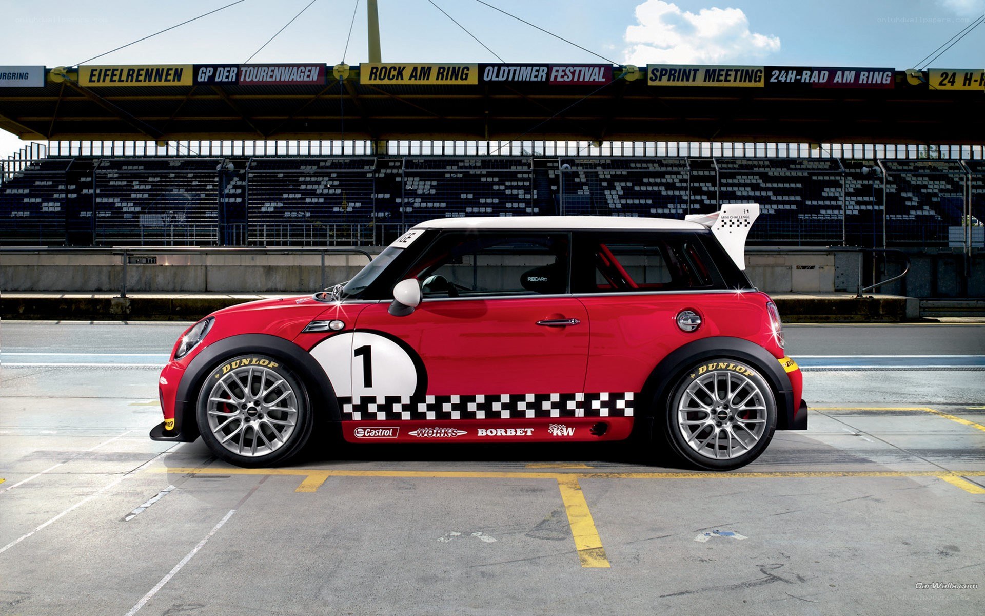 Red MINI race car on track