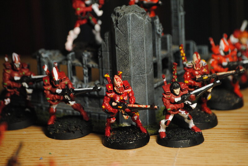 red miniatures on a table