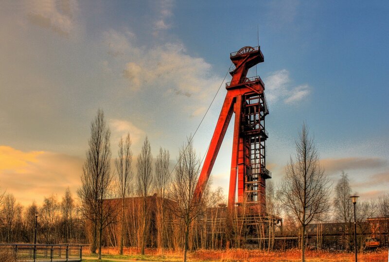 Red mining tower at sunset