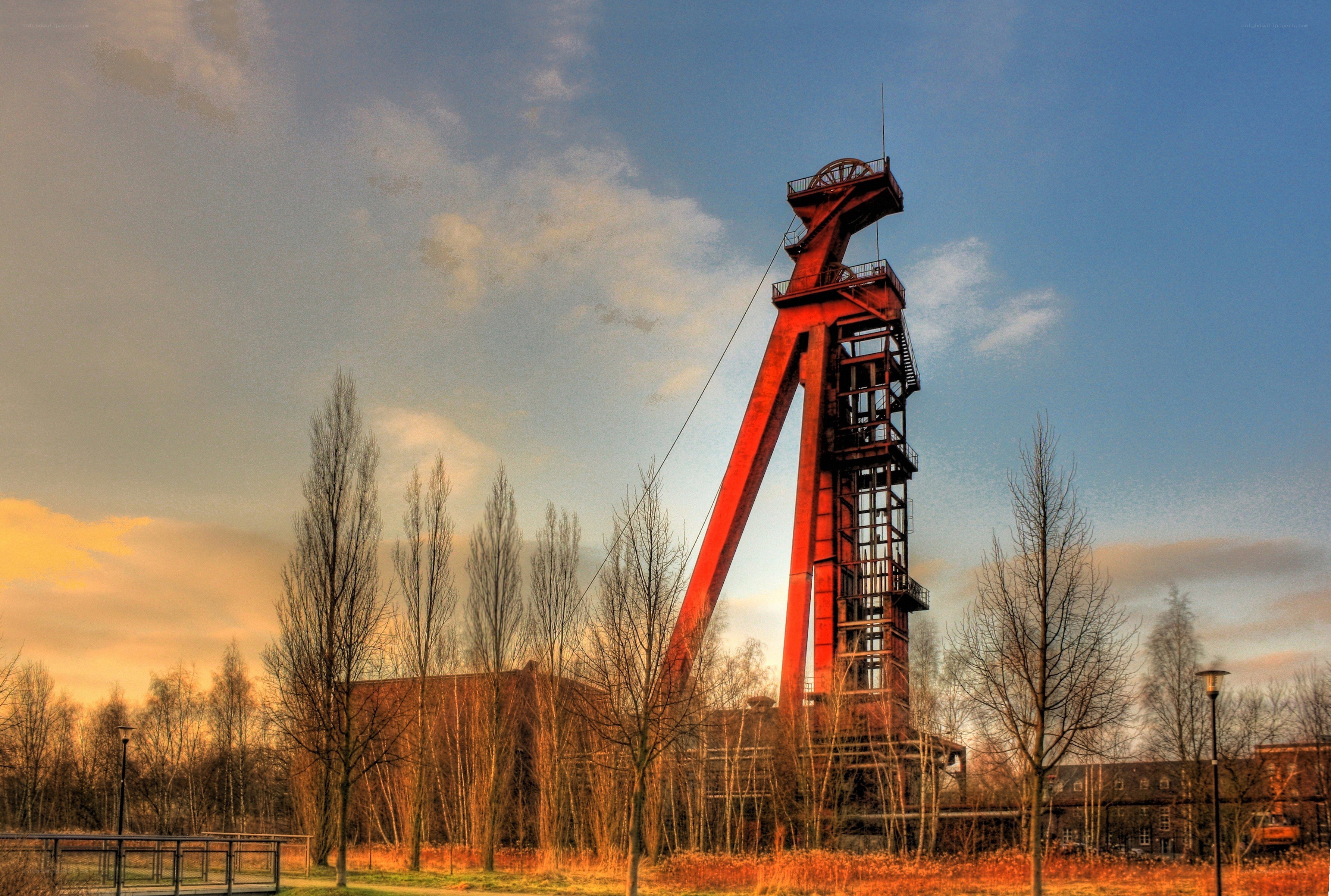 Red mining tower at sunset