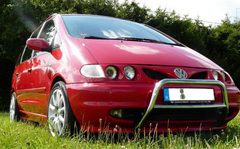 red minivan in grass