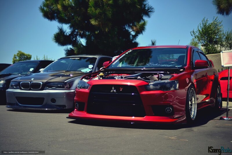Red Mitsubishi and BMW at car show