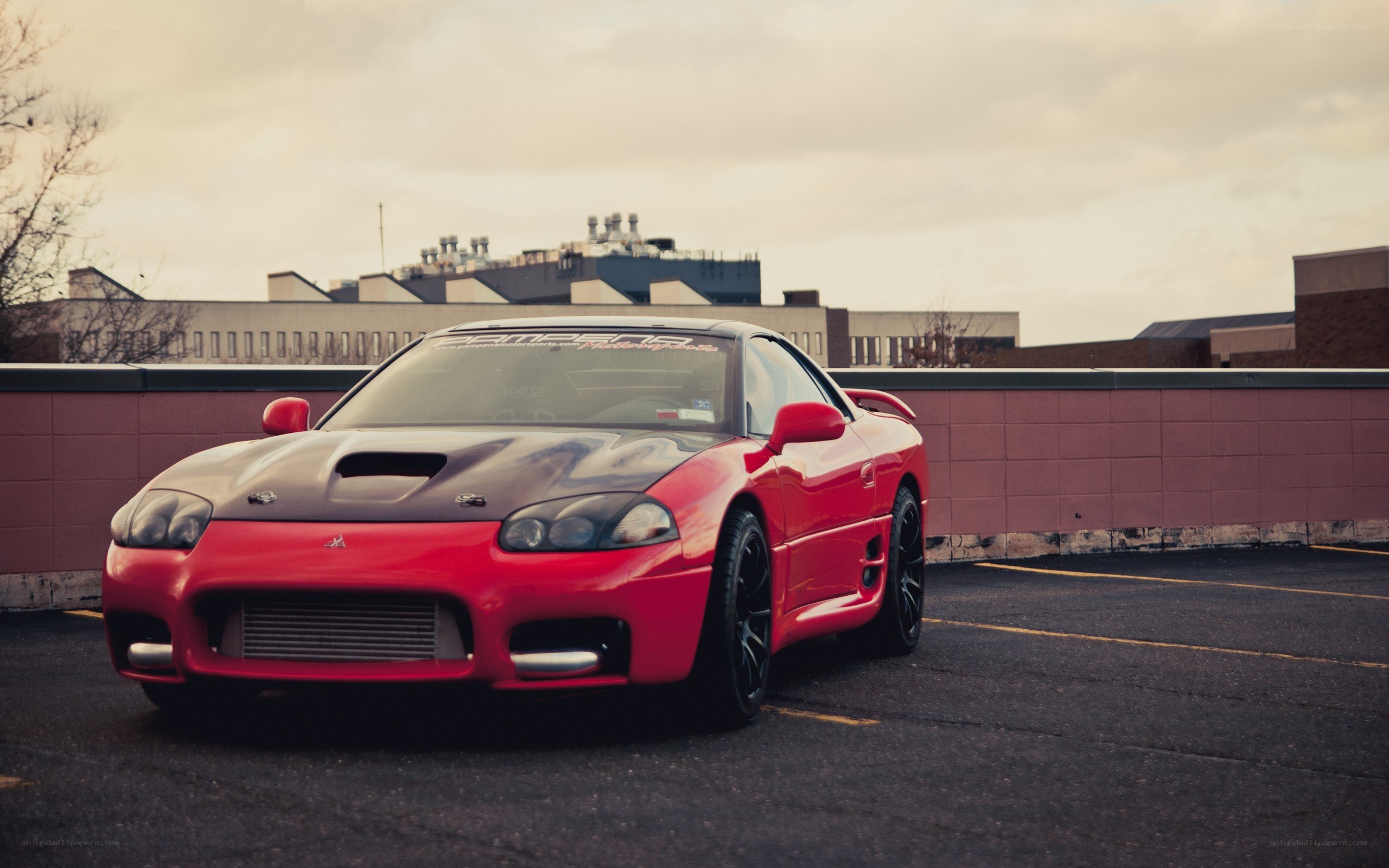 Red Mitsubishi Eclipse on rooftop