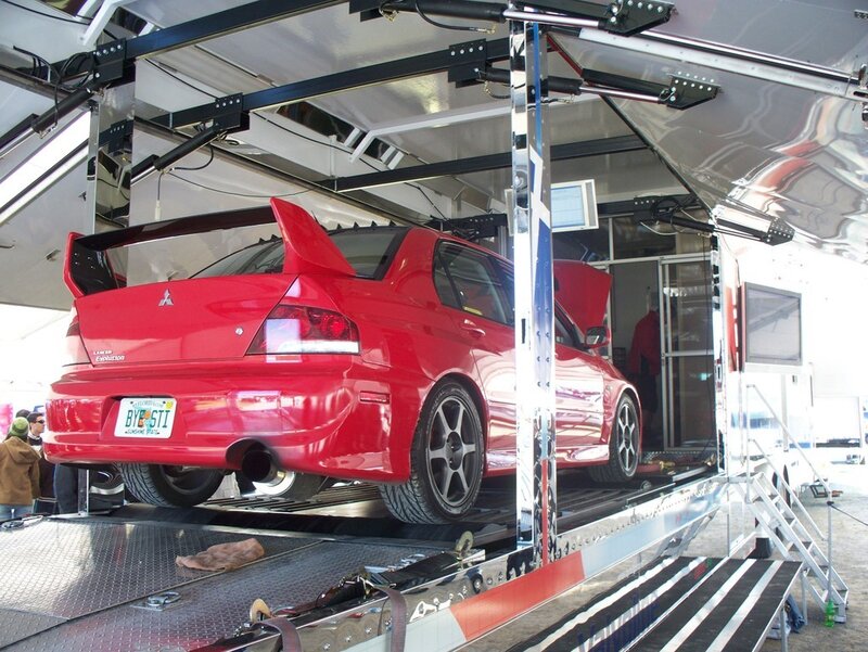 Red Mitsubishi Evolution on trailer