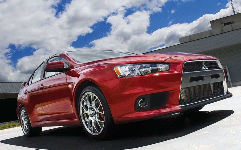 Red Mitsubishi Lancer — Dramatic, Afternoon, Photograph, Car, Building
