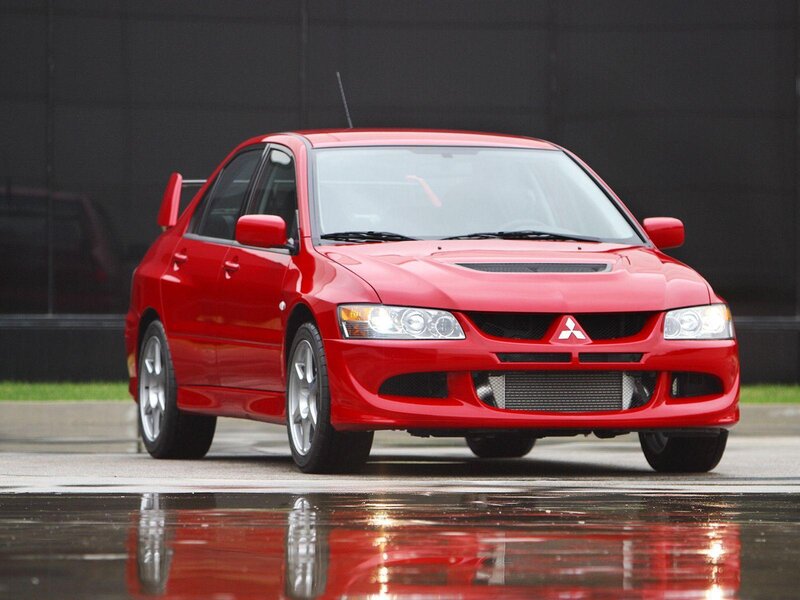 Red Mitsubishi Lancer — Dramatic, Photograph, Car, Wet Pavement