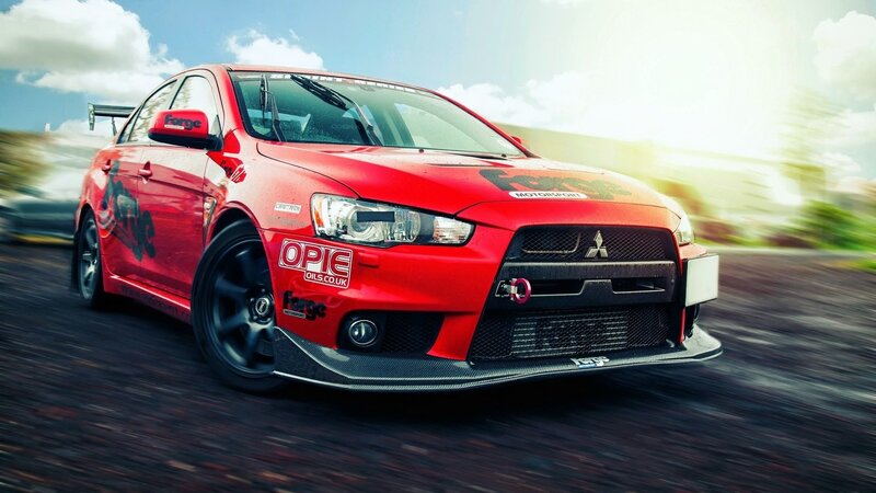 red mitsubishi lancer evo on track