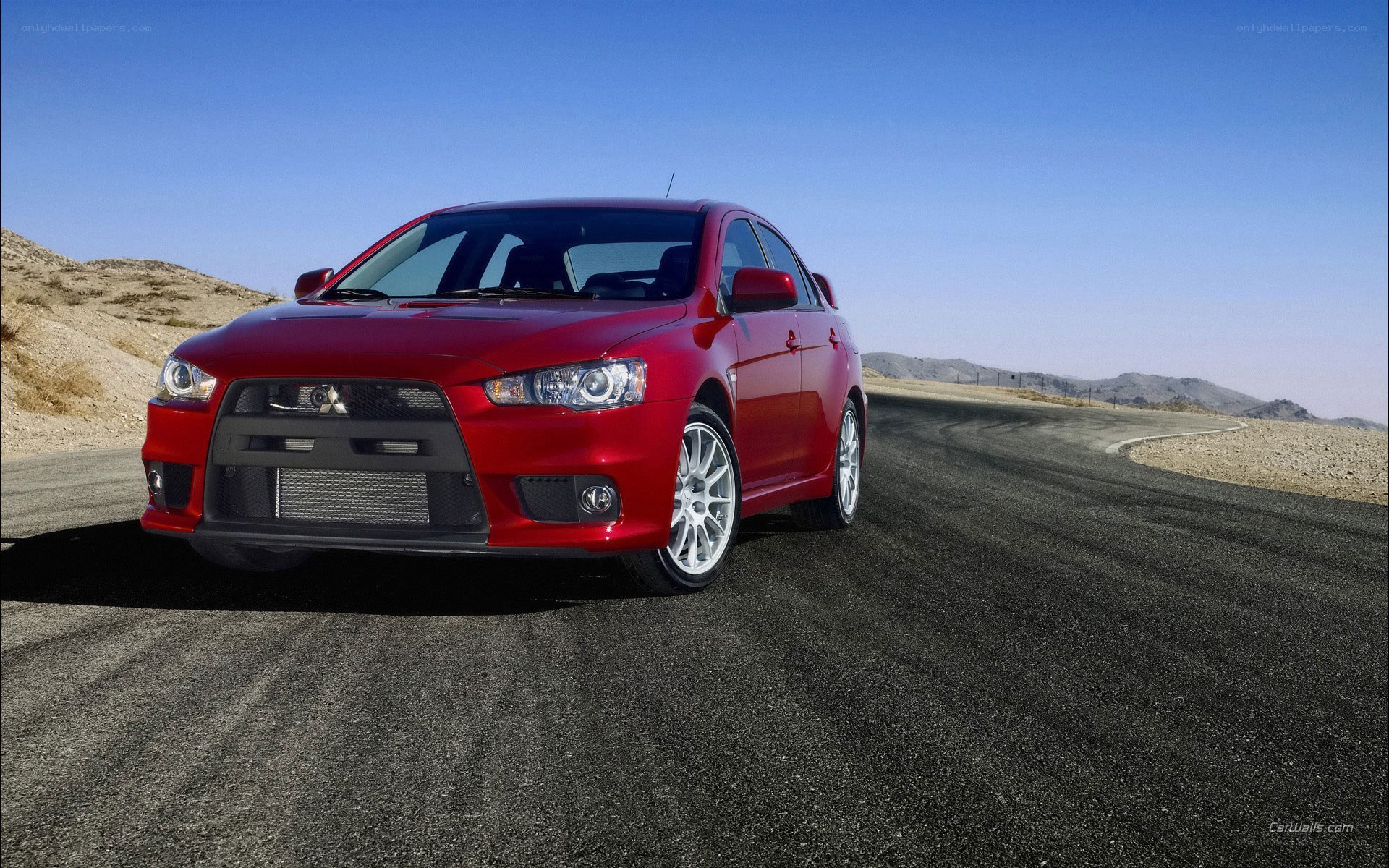 red mitsubishi lancer evolution