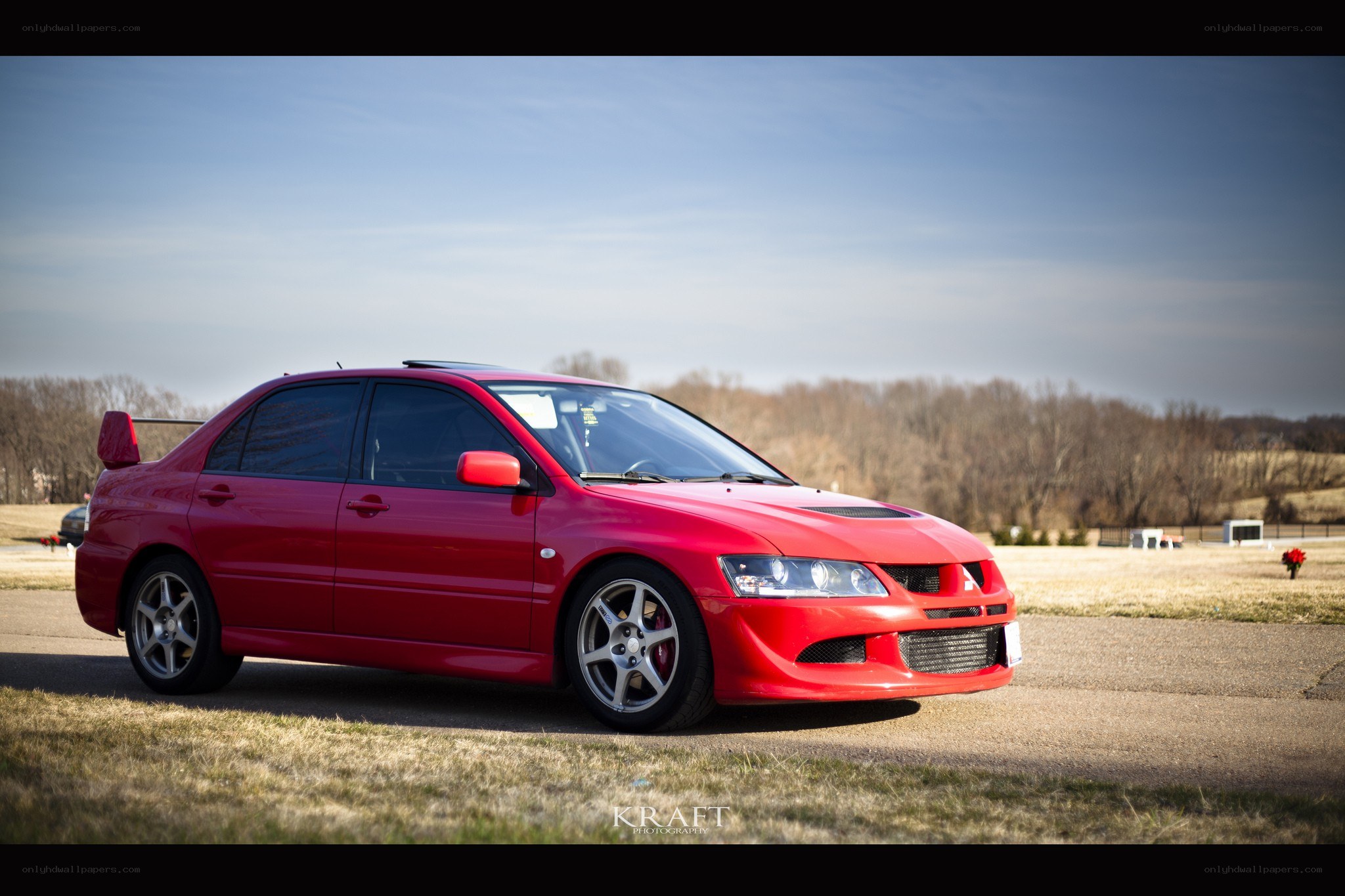 red mitsubishi lancer evolution