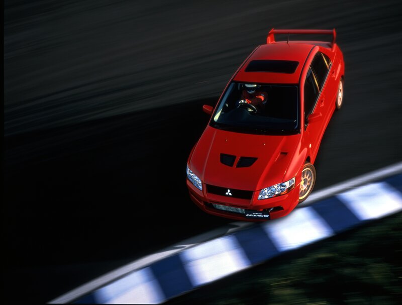 Red Mitsubishi Lancer Evolution on track