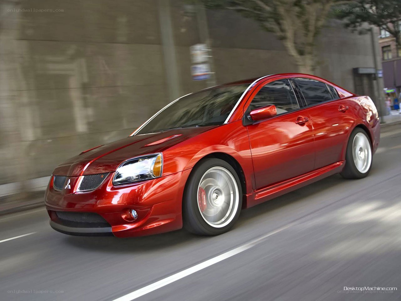 Red Mitsubishi Lancer in motion