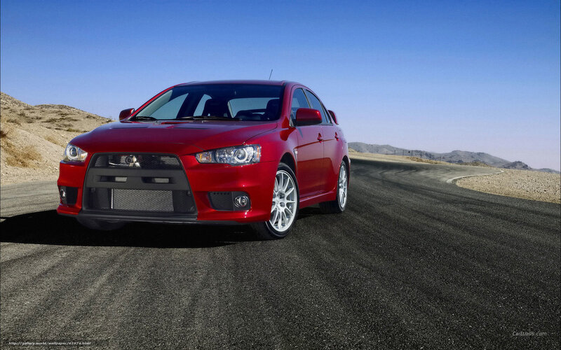 Red Mitsubishi Lancer on desert road