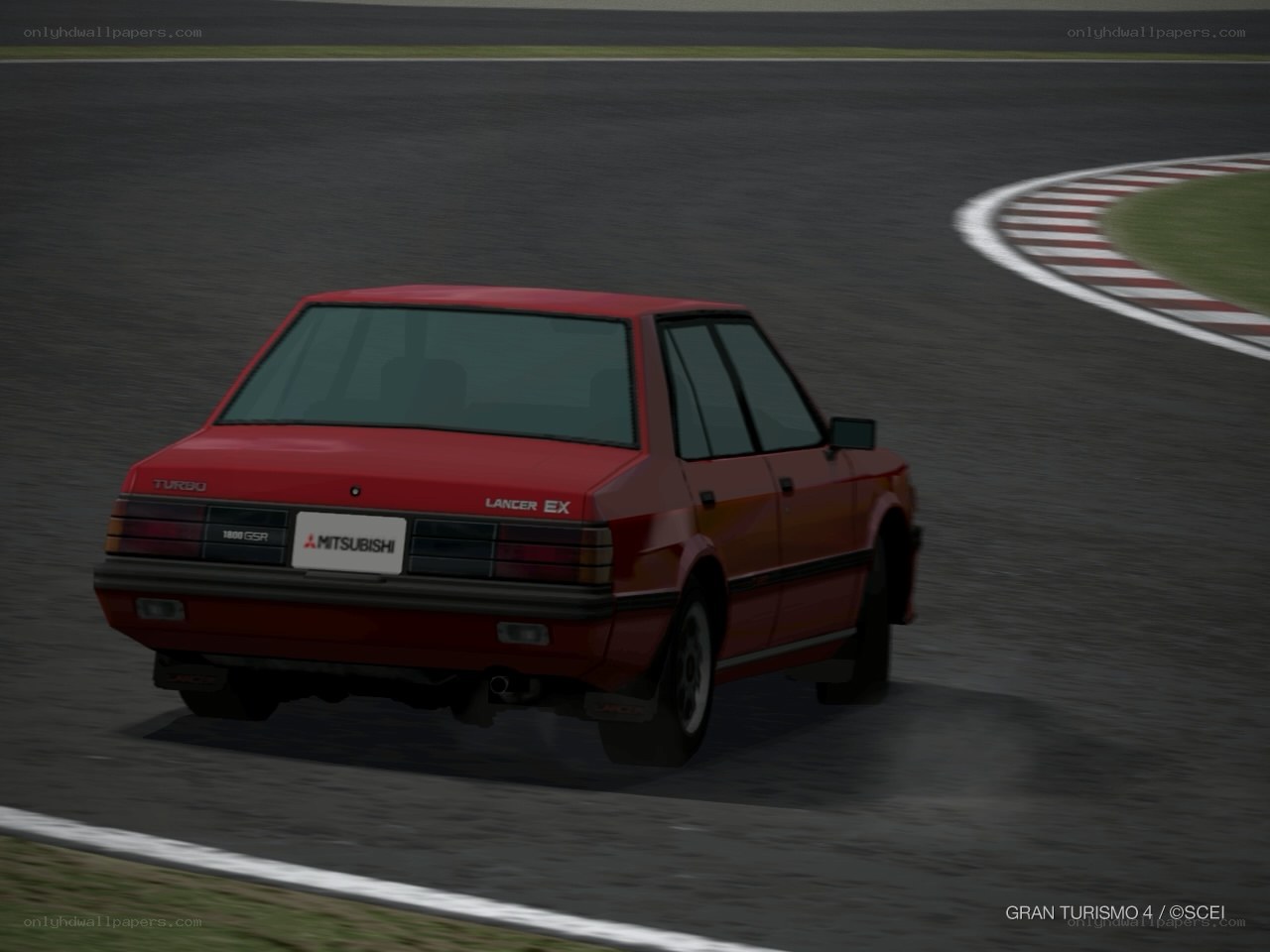 Red Mitsubishi Lancer on track