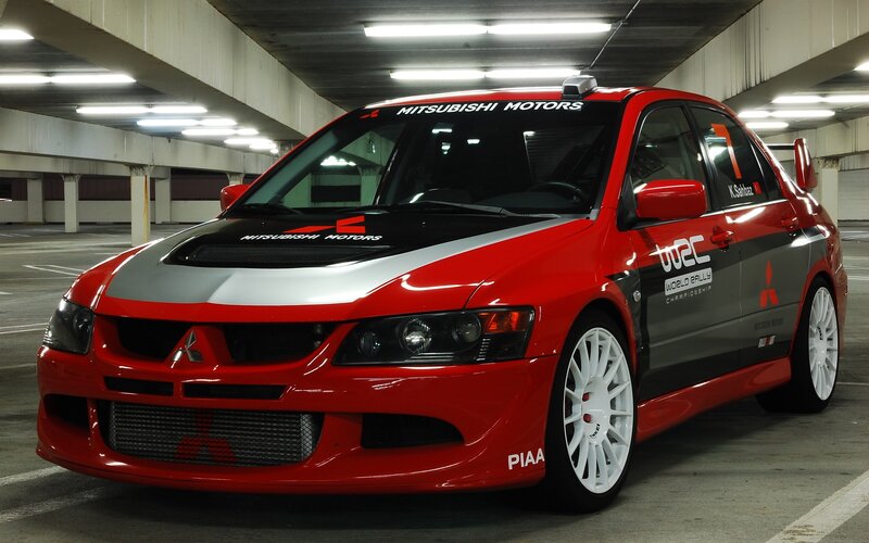Red Mitsubishi Lancer rally car