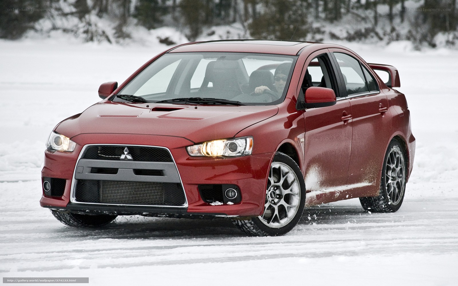 red mitsubishi on snowy road