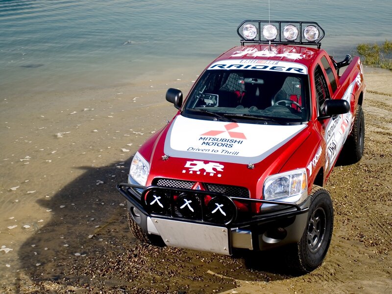 Red Mitsubishi Raider off-road truck