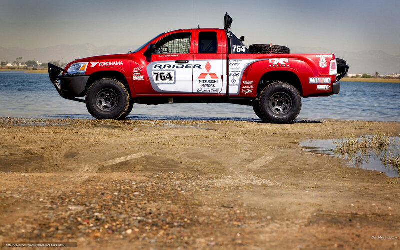 Red Mitsubishi Raider pickup truck