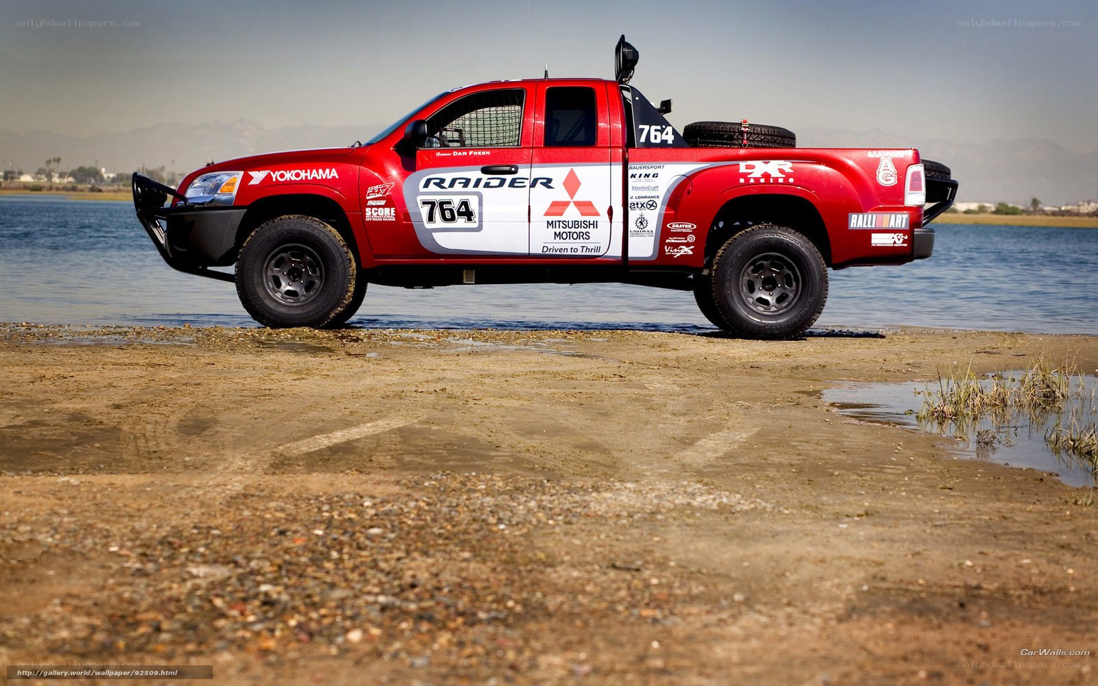 Red Mitsubishi Raider pickup truck