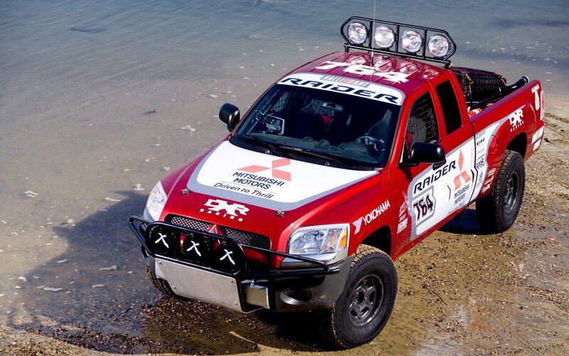 Red Mitsubishi Raider race truck