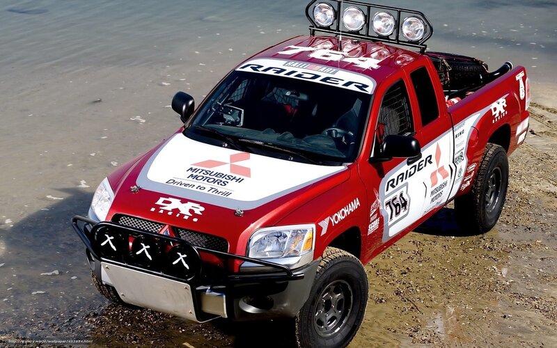 Red Mitsubishi Raider race truck