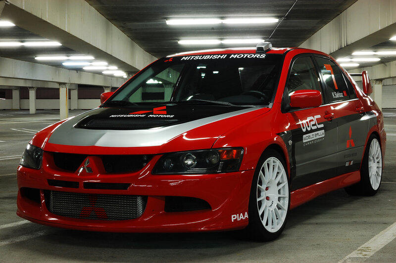 Red Mitsubishi rally car in garage