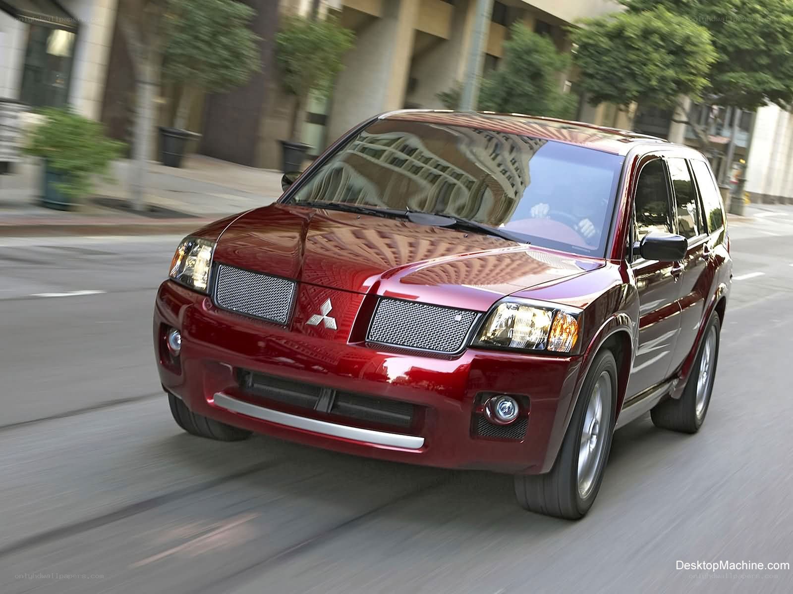 Red Mitsubishi SUV in motion