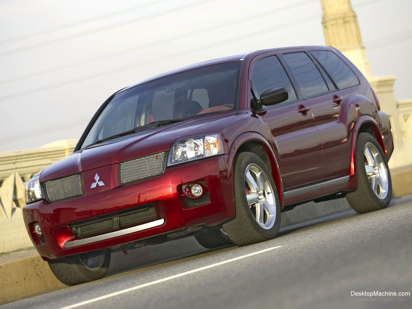red mitsubishi suv on bridge
