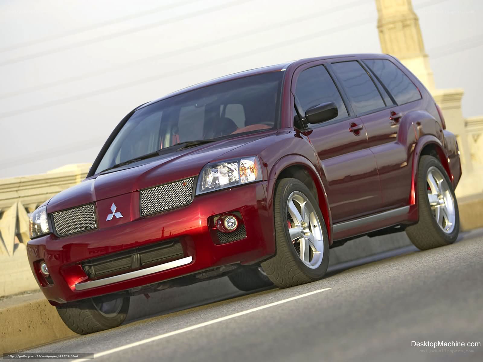red mitsubishi suv on bridge