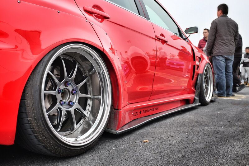Red Modified Car — Calm, Photograph, People