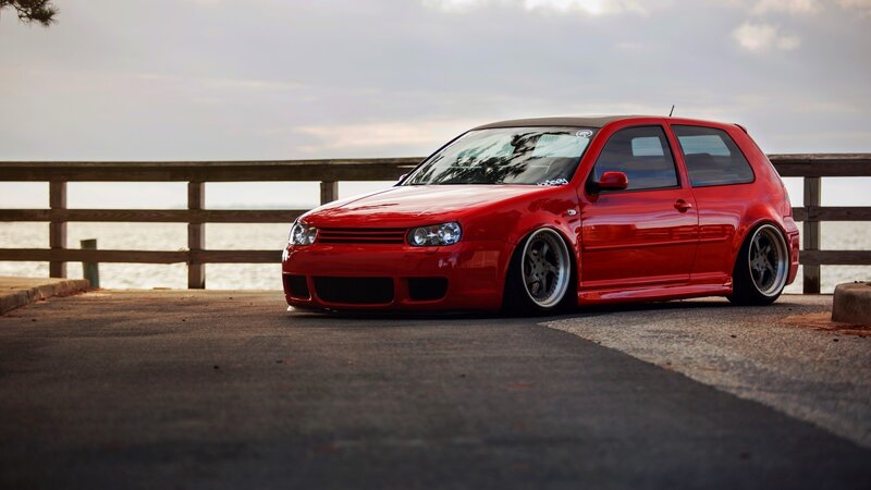 Red Modified Car — Calm, Sunset