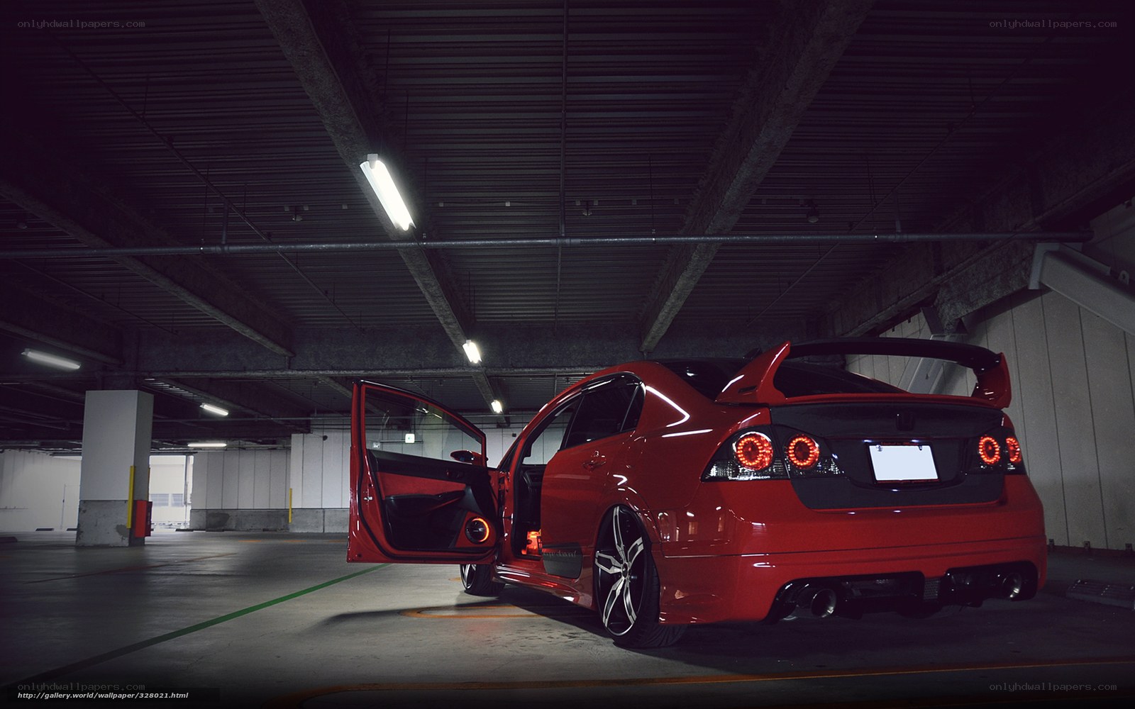 Red modified car in garage