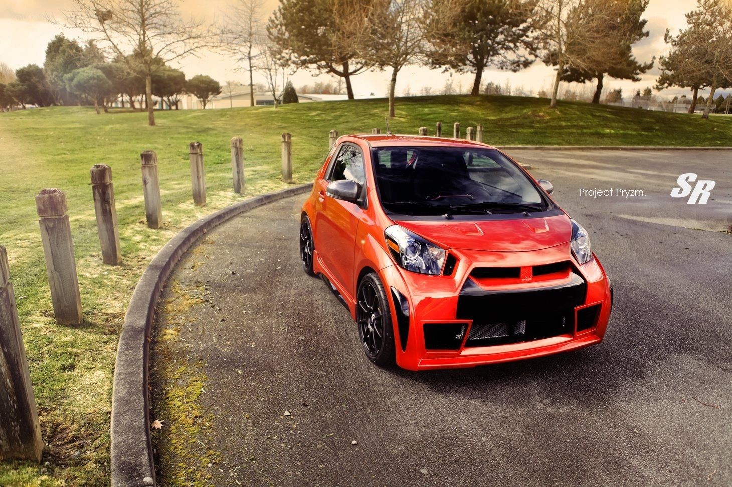 Red modified car on a road