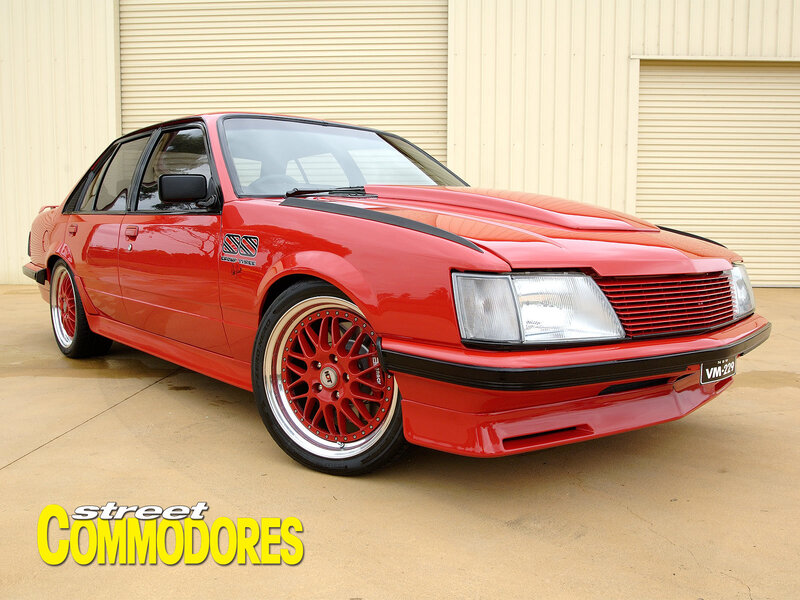 Red modified Commodore sedan